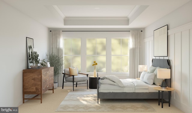 carpeted bedroom featuring a tray ceiling