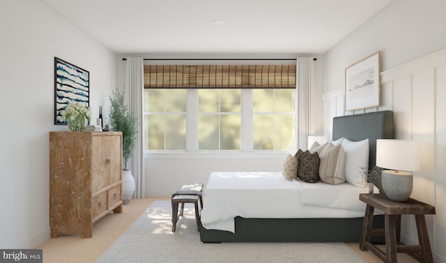 bedroom featuring light colored carpet