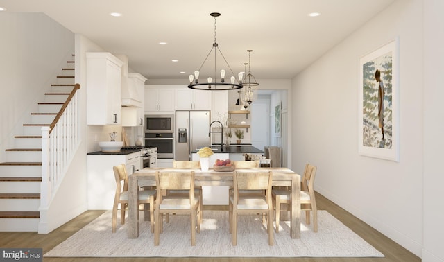 dining area featuring a chandelier and hardwood / wood-style flooring