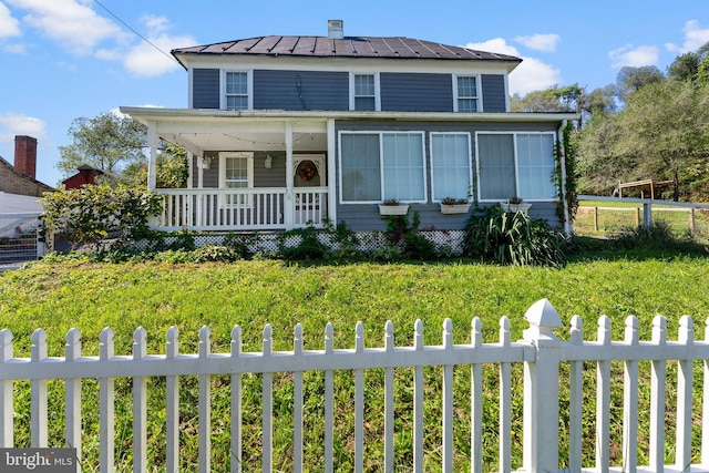 view of front facade with a front lawn and a porch