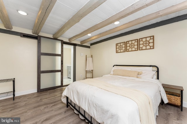 bedroom featuring hardwood / wood-style floors and beamed ceiling