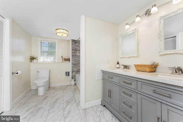 full bathroom featuring vanity, shower / bath combination, and toilet