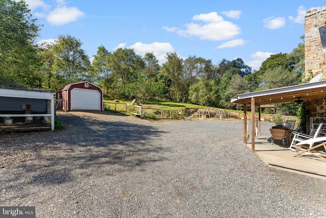 view of yard with an outdoor structure and a garage