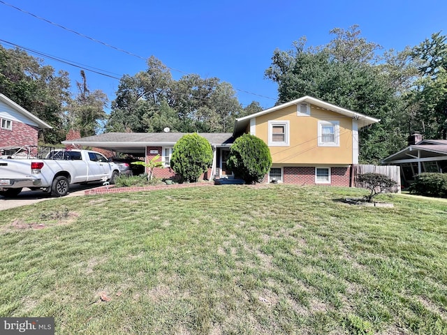 tri-level home featuring a front yard