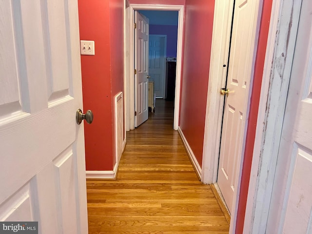 hallway with light wood-type flooring