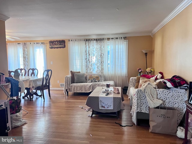 living room featuring ornamental molding and hardwood / wood-style flooring