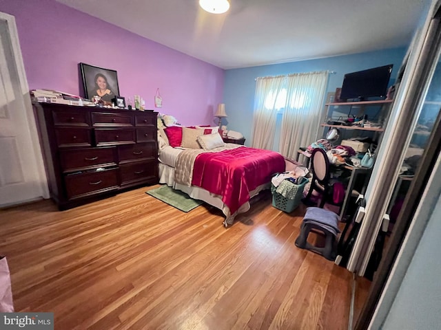 bedroom with light wood-type flooring