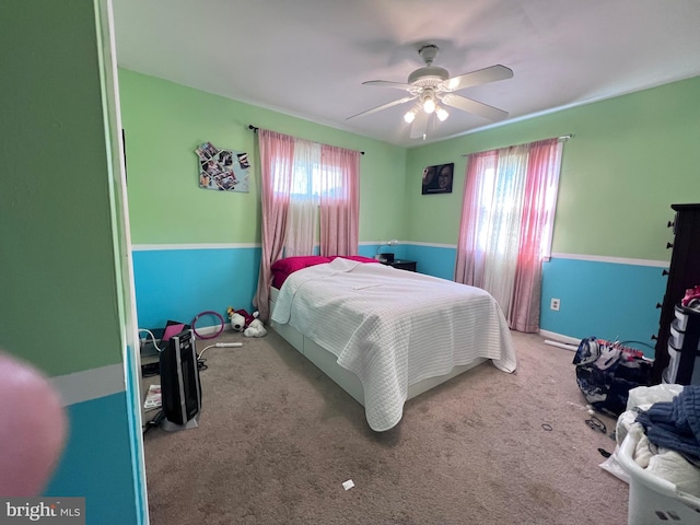 bedroom with multiple windows, carpet floors, and ceiling fan