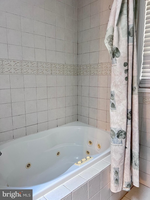 bathroom featuring a relaxing tiled tub