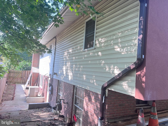 view of home's exterior with cooling unit