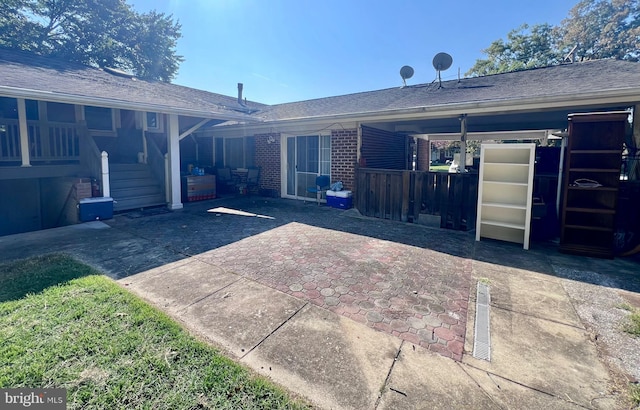 back of property with a patio area