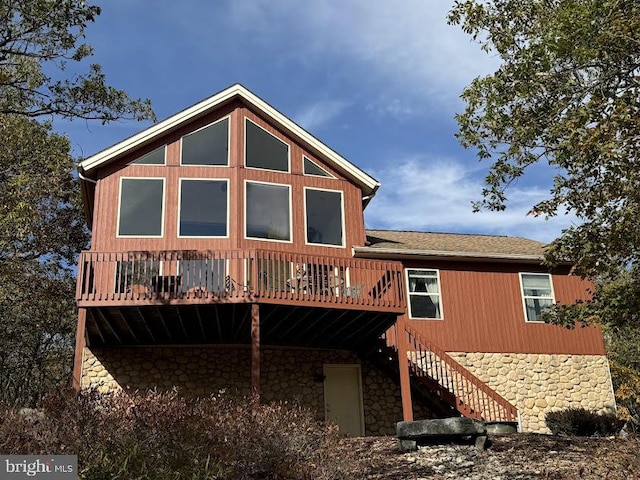 back of house featuring a wooden deck