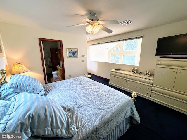 bedroom featuring ceiling fan and ensuite bathroom