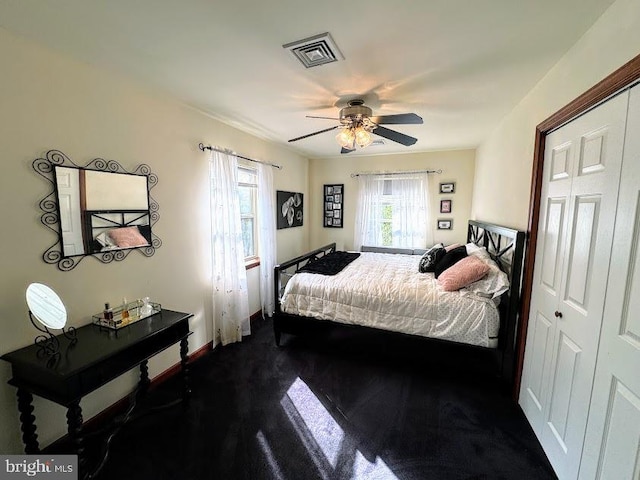 bedroom featuring ceiling fan and a closet