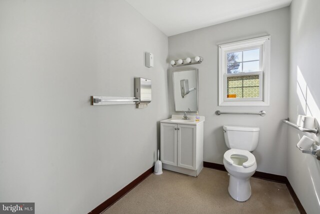 bathroom with toilet and vanity