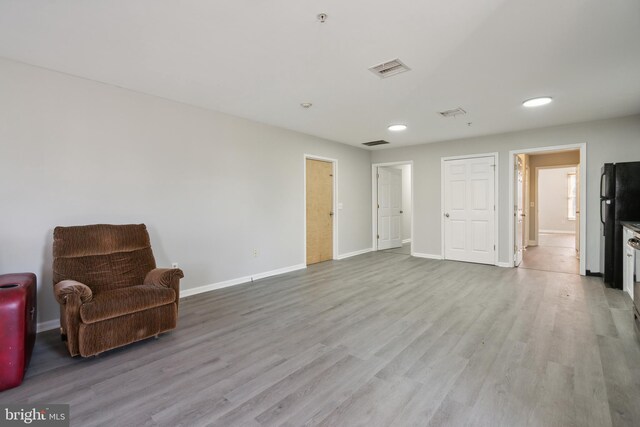 unfurnished room with light hardwood / wood-style flooring