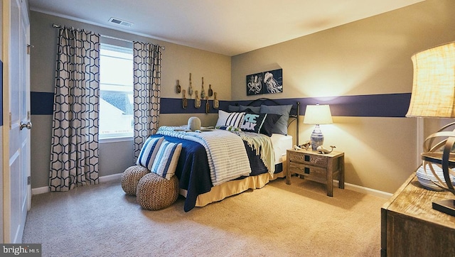 carpeted bedroom with multiple windows