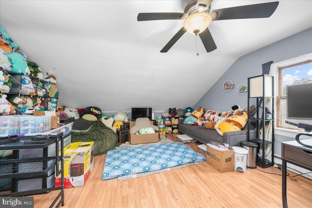 interior space featuring vaulted ceiling, hardwood / wood-style flooring, and ceiling fan