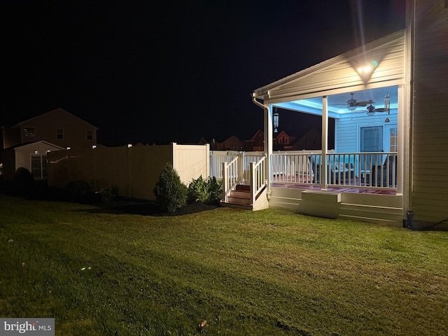 view of yard at twilight