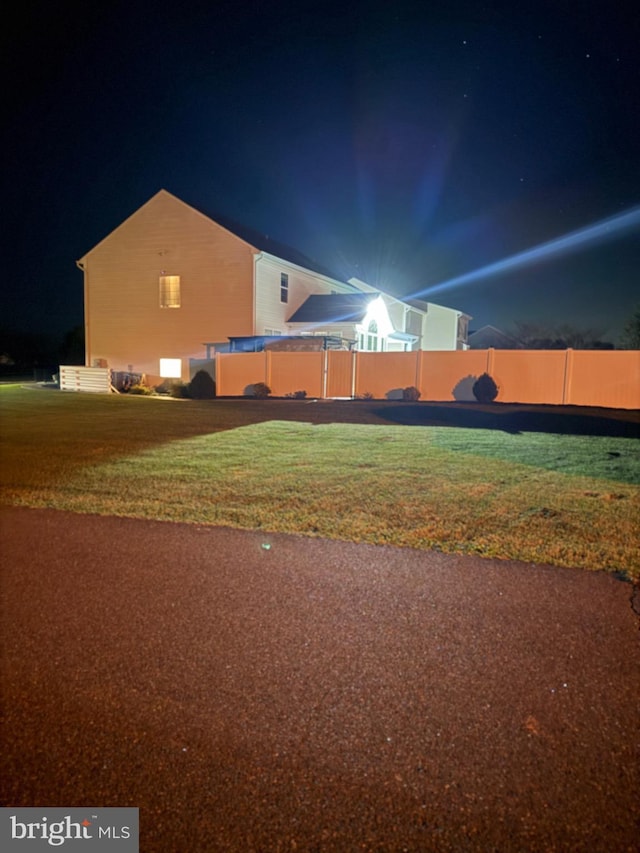 view of yard at night