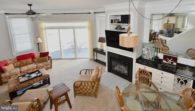 9 134th St Unit 9B, Ocean City, MD 21842 - carpeted living room featuring a ceiling fan, crown molding, and a glass covered fireplace