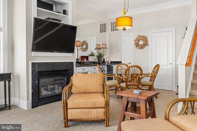9 134th St Unit 9B, Ocean City, MD 21842 - living room featuring visible vents, a premium fireplace, ornamental molding, and light colored carpet
