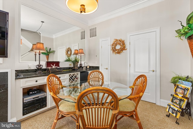 9 134th St Unit 9B, Ocean City, MD 21842 - dining room featuring light carpet, ornamental molding, visible vents, and baseboards