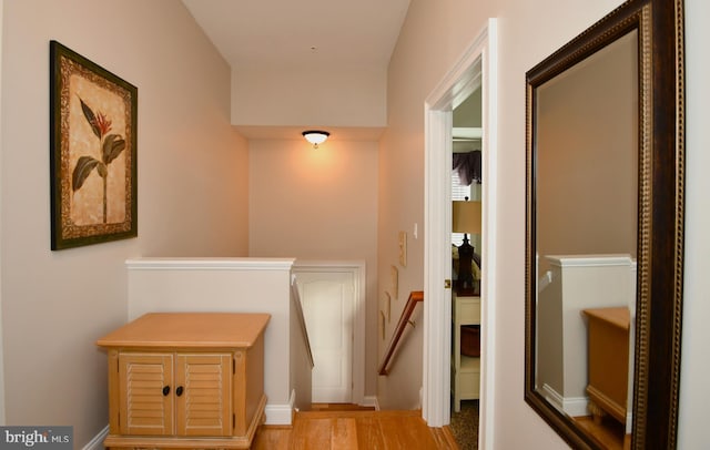 hall with light hardwood / wood-style floors