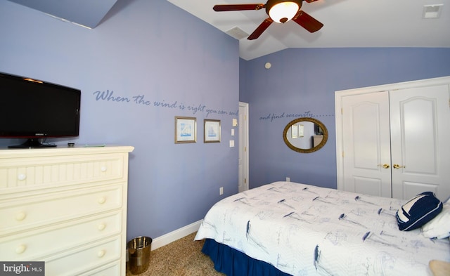 bedroom featuring lofted ceiling, carpet floors, ceiling fan, and a closet