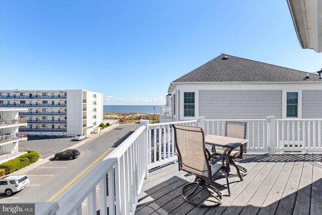 9 134th St Unit 9B, Ocean City, MD 21842 - wooden deck with outdoor dining space and a water view