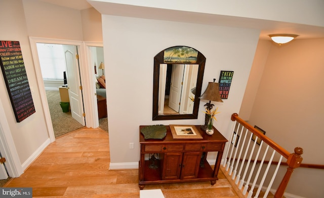 hall with light hardwood / wood-style floors