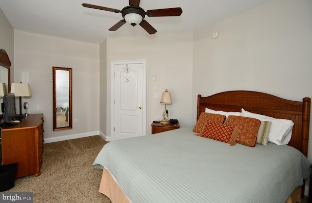 carpeted bedroom featuring ceiling fan