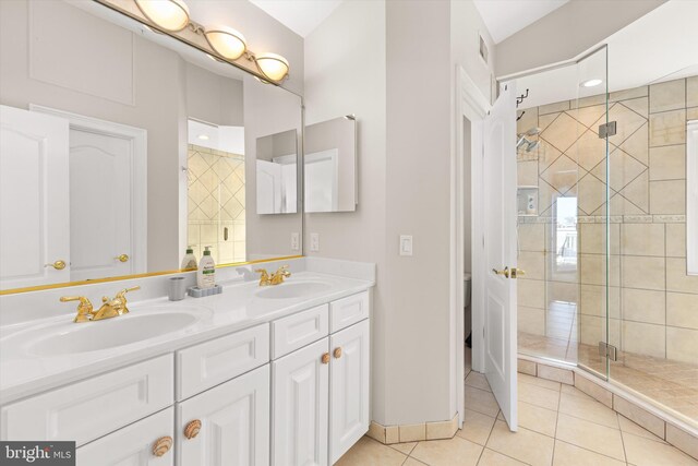 9 134th St Unit 9B, Ocean City, MD 21842 - bathroom featuring tile patterned floors, a sink, a shower stall, and double vanity
