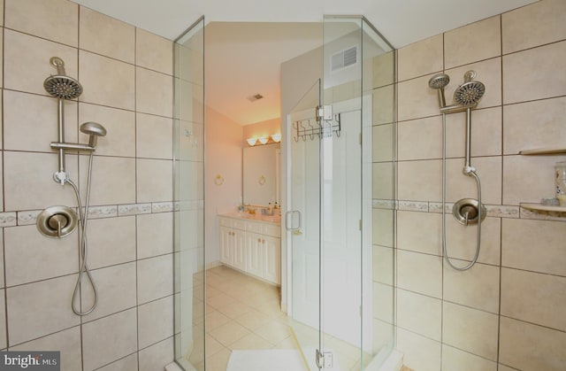 9 134th St Unit 9B, Ocean City, MD 21842 - bathroom featuring visible vents, tile patterned floors, vanity, and a stall shower
