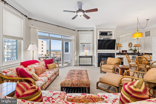 9 134th St Unit 9B, Ocean City, MD 21842 - carpeted living room with a glass covered fireplace, visible vents, ceiling fan, and crown molding