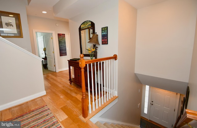 stairway with wood-type flooring