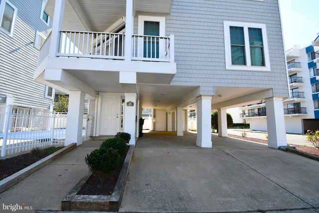 entrance to property featuring a carport