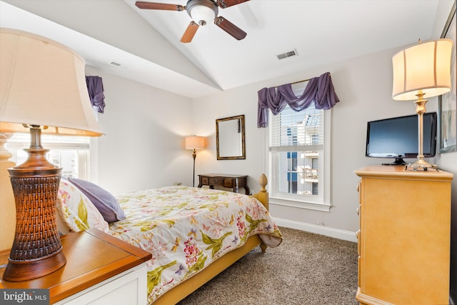 bedroom with vaulted ceiling, ceiling fan, and dark carpet