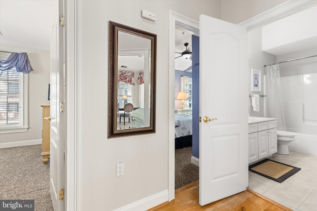 full bathroom with shower / bath combination with curtain, vanity, and toilet