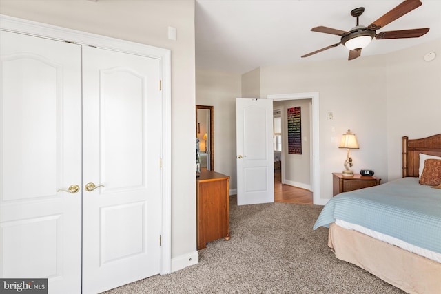 9 134th St Unit 9B, Ocean City, MD 21842 - bedroom with light carpet, a ceiling fan, baseboards, and a closet