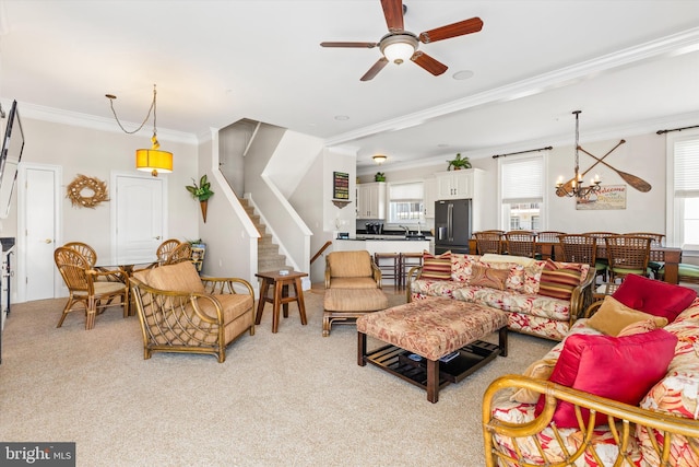 9 134th St Unit 9B, Ocean City, MD 21842 - living room featuring stairway, ornamental molding, light carpet, and ceiling fan with notable chandelier