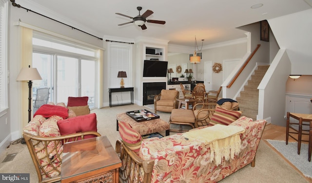9 134th St Unit 9B, Ocean City, MD 21842 - living area featuring stairway, a ceiling fan, carpet floors, ornamental molding, and visible vents