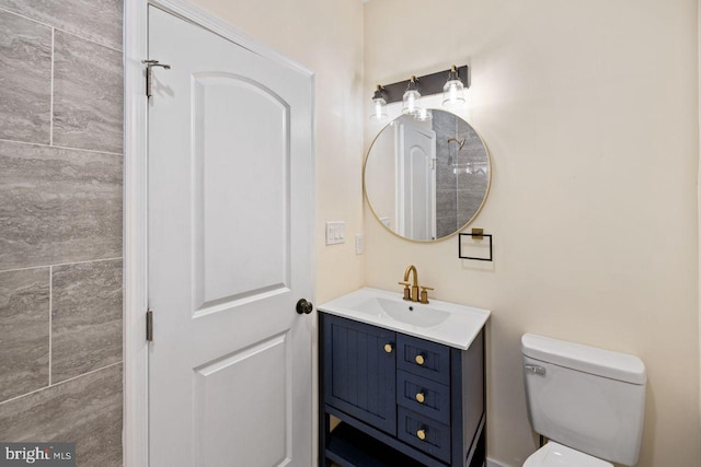 bathroom with vanity and toilet