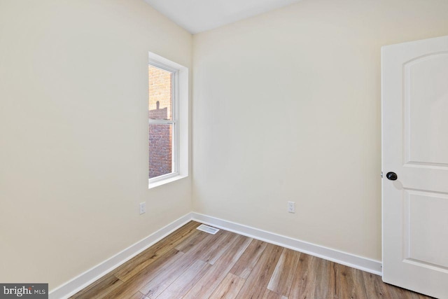 unfurnished room with light hardwood / wood-style flooring