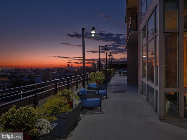 view of patio terrace at dusk