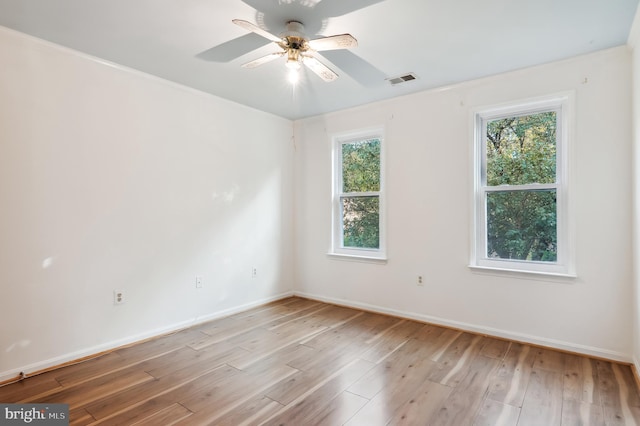 unfurnished room with light wood-type flooring and ceiling fan