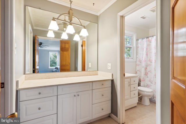 bathroom featuring ceiling fan with notable chandelier, plenty of natural light, and ornamental molding