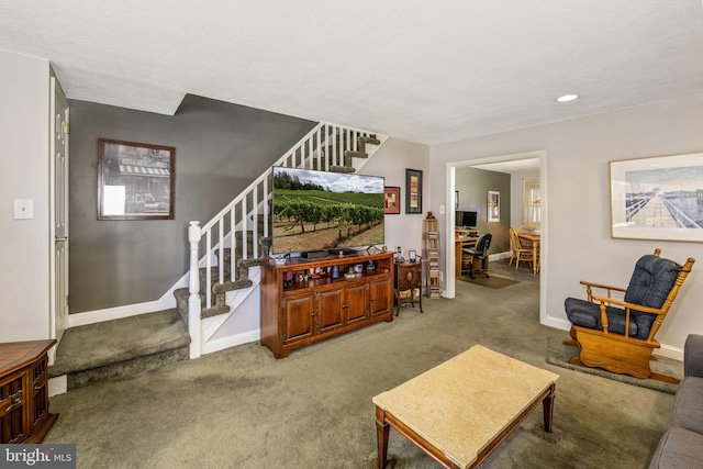 living room featuring a textured ceiling and carpet flooring