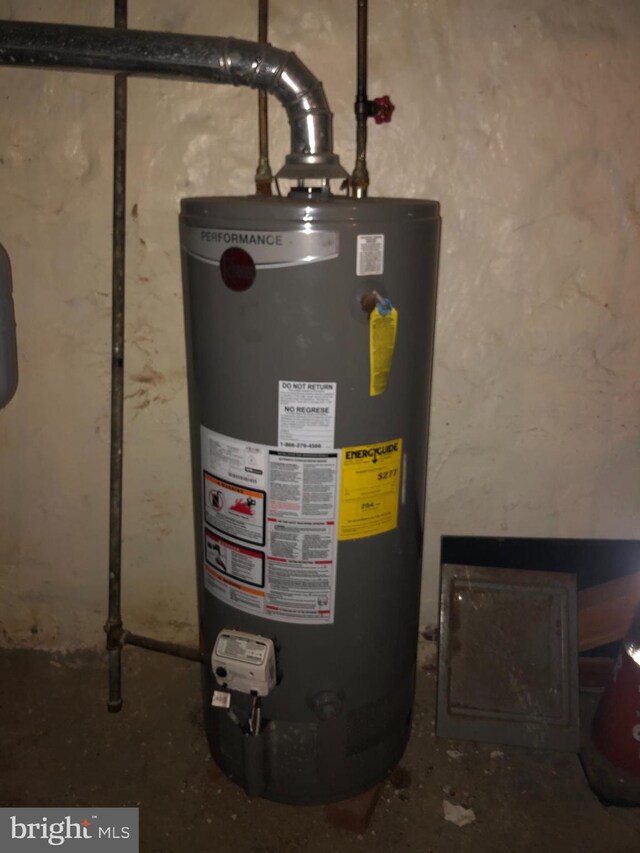 utility room with water heater