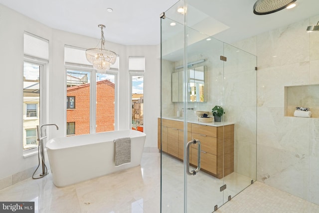 bathroom with an inviting chandelier, sink, separate shower and tub, and tile patterned flooring